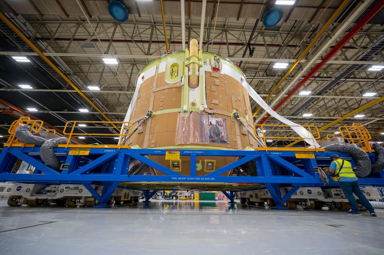On May 24, 2022, the core stage production team moved the Space Launch System (SLS) rocket engine section for Artemis II to the core stage final integration area at NASA’s Michoud Assembly Facility in New Orleans.  While there, the engine section team is completing installation of the main propulsion systems, finishing integration of the electrical and avionics systems, and preparing for functional testing of the various systems. During final integration, the team also will install remaining internal thermal protection systems and prepare to position the engine section from vertical to horizontal so that it can be joined with the rest of the core stage. The engine section is located at the bottom of the core stage and includes the rocket’s main propulsion systems that connect to the core stage’s four RS-25 engines that will help launch the Artemis II lunar mission. This fall, the engine section will be horizontally integrated with the previously-joined forward assembly and liquid hydrogen tank to complete the core stage. NASA and core stage lead contractor Boeing are building core stages for the next three Artemis missions.  The 212-foot core stage with its RS-25 engines will provide more than 2 million pounds of thrust at launch. With Artemis, NASA will land the first woman and the first person of color on the Moon and establish long-term exploration in preparation for missions to Mars. SLS and NASA’s Orion spacecraft, along with the commercial human landing system and the Gateway in orbit around the Moon, are NASA’s backbone for deep space exploration. SLS is the only rocket that can send Orion, astronauts, and supplies to the Moon in a single mission.  